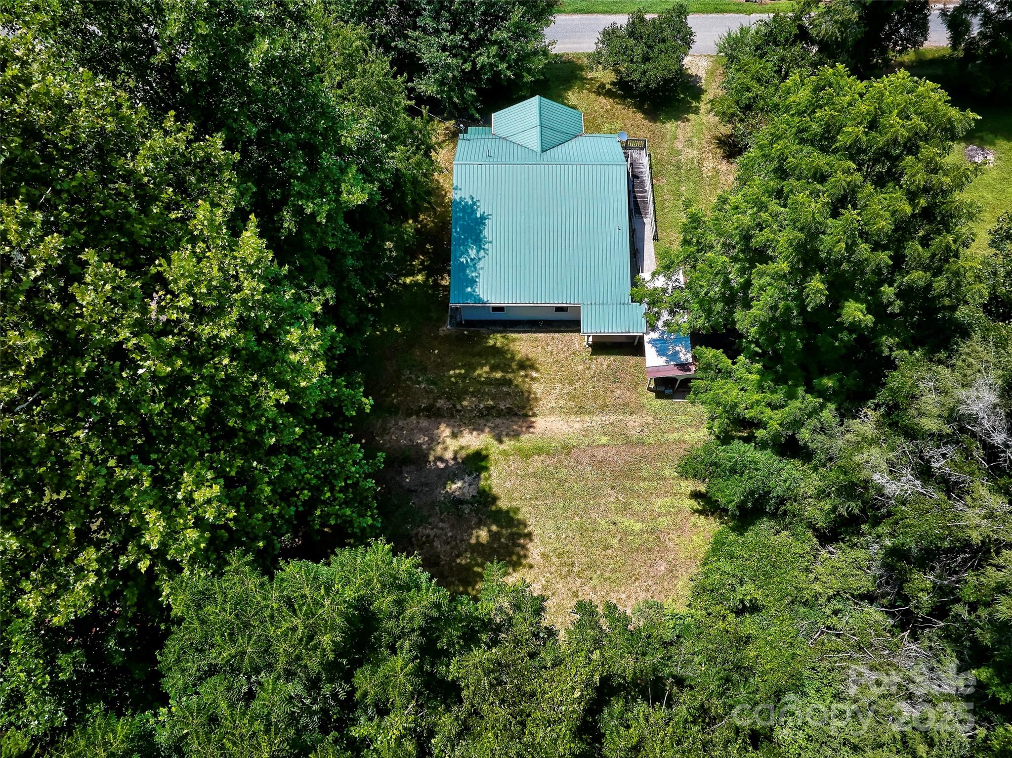 111 Kenneth Cooper Road Whittier, NC 28789 - Photo 7 of 30 an aerial view of a house with a yard