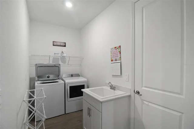 a utility room with dryer and washer