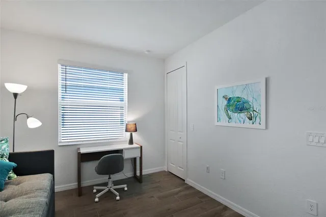 a workspace with furniture and a window