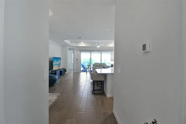 a dining room with furniture and wooden floor