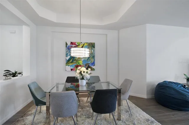 a dining room with furniture and window