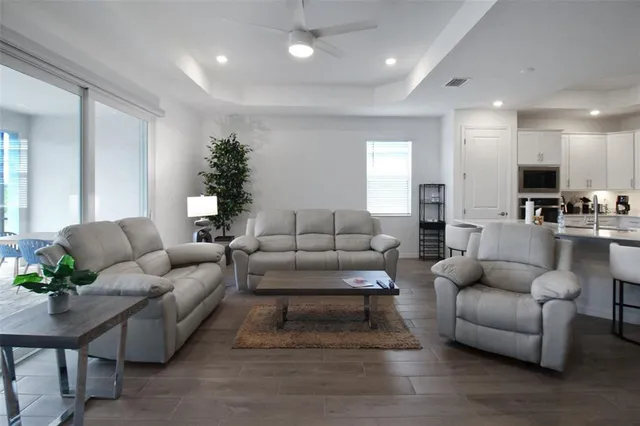 a living room with furniture and a fireplace