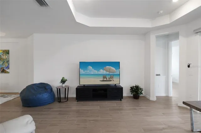 a view of a chairs and table in patio