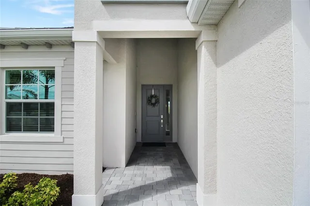 a view of a house with a door and a window