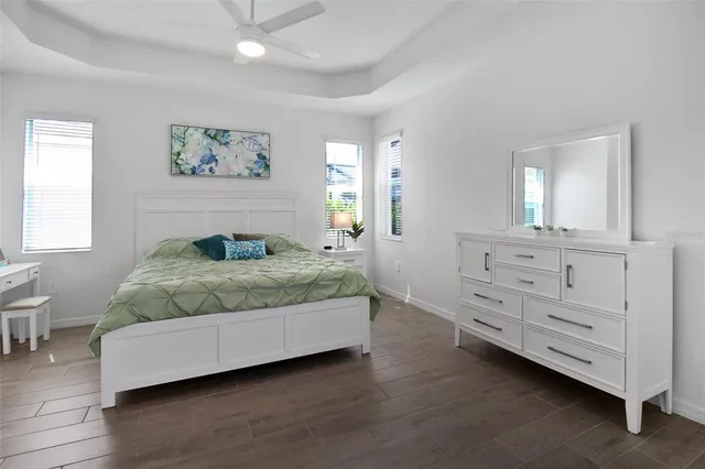 a bedroom with a bed and a table in it