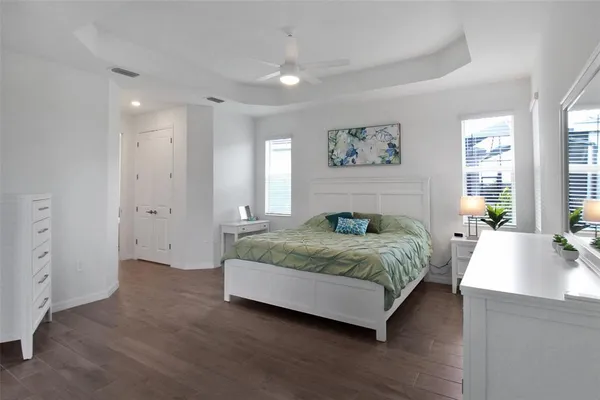 a bedroom with a bed and a couch