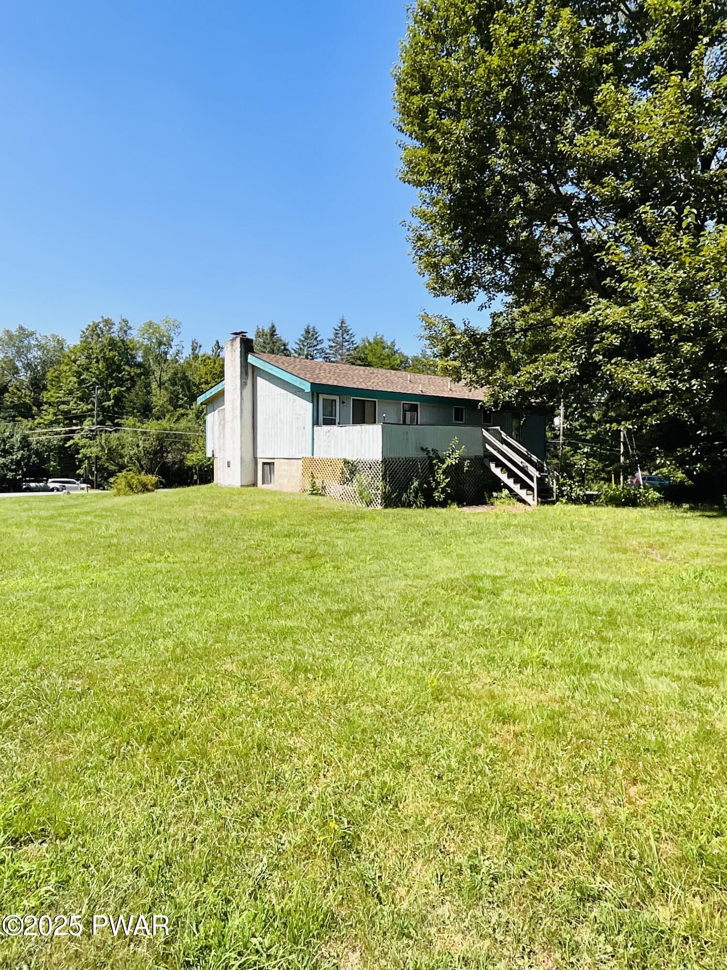 30 Brookfield Road, Unit LOT 1259 Lake Ariel, PA 18436 - Photo 16 of 32 a view of a house with a yard