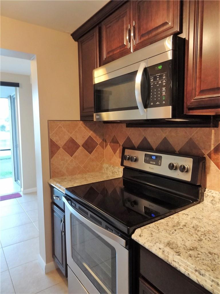 3670 Inverrary Drive, Unit 1L Lauderhill, FL 33319 - Photo 2 of 26 a close view of stove