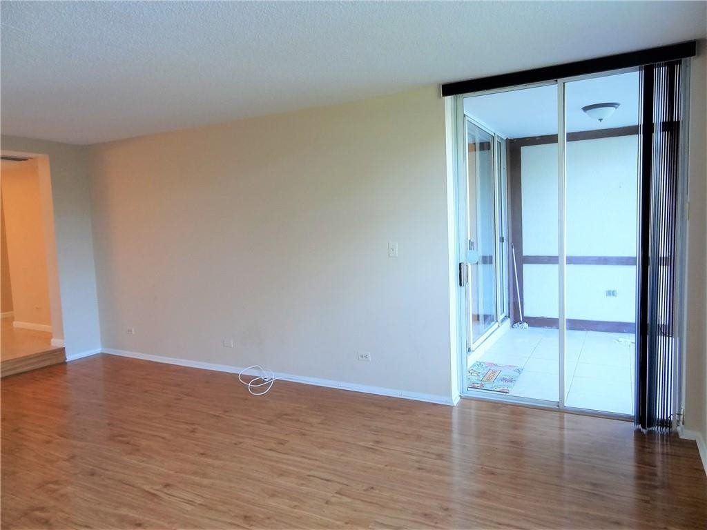 3670 Inverrary Drive, Unit 1L Lauderhill, FL 33319 - Photo 10 of 26 wooden floor in an empty room