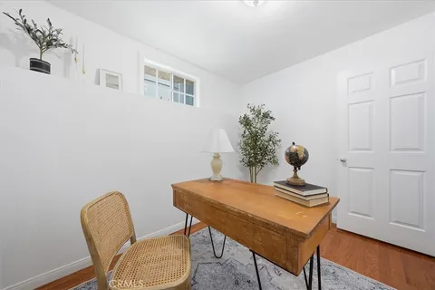 a view of a workspace with furniture