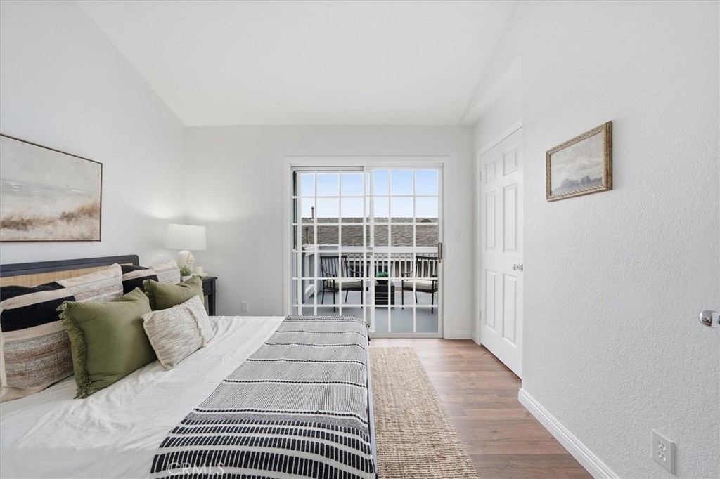 1534 Marcelina Avenue, Unit D Torrance, CA 90501 - Photo 13 of 29 a bedroom with a large bed and a window
