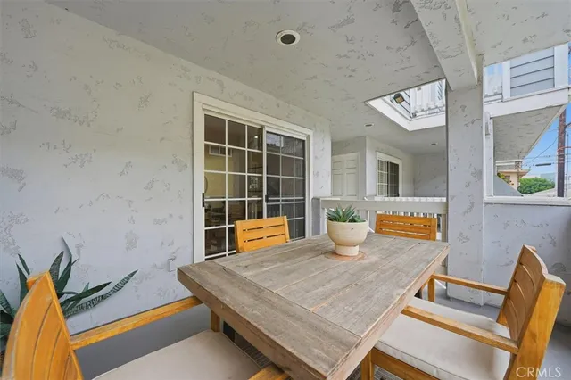 a room with furniture pool table and glass door