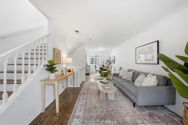 a living room with furniture and a painting