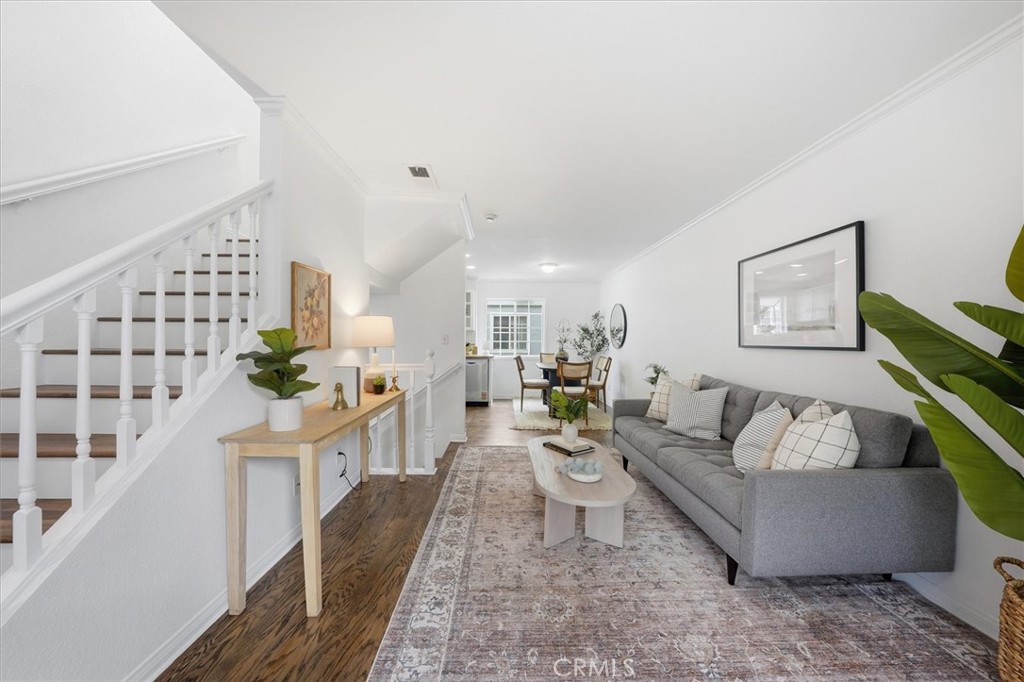 1534 Marcelina Avenue, Unit D Torrance, CA 90501 - Photo 3 of 29 a living room with furniture and a painting