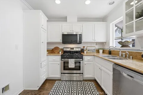 a kitchen with a stove and a sink