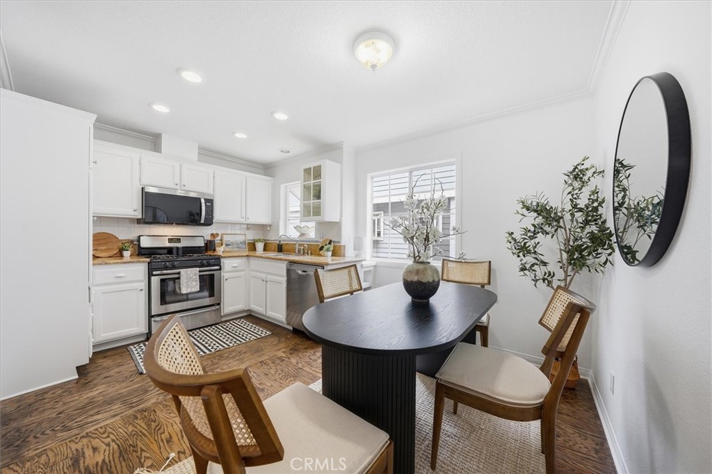 1534 Marcelina Avenue, Unit D Torrance, CA 90501 - Photo 8 of 29 a kitchen with a table chairs and a dining table