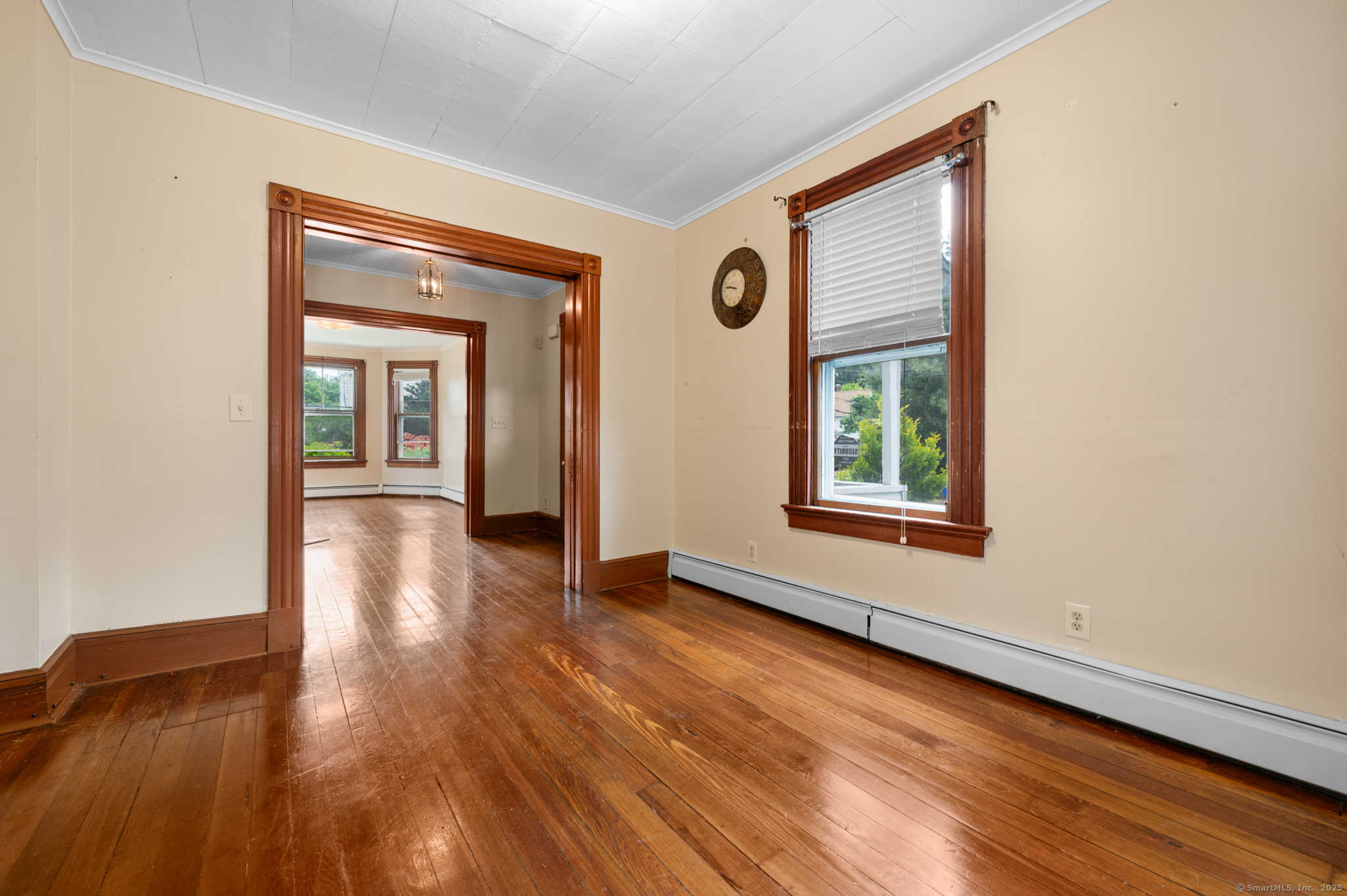 175 Lincoln Street Middletown, CT 06457 - Photo 12 of 33 a view of an empty room with wooden floor and a window