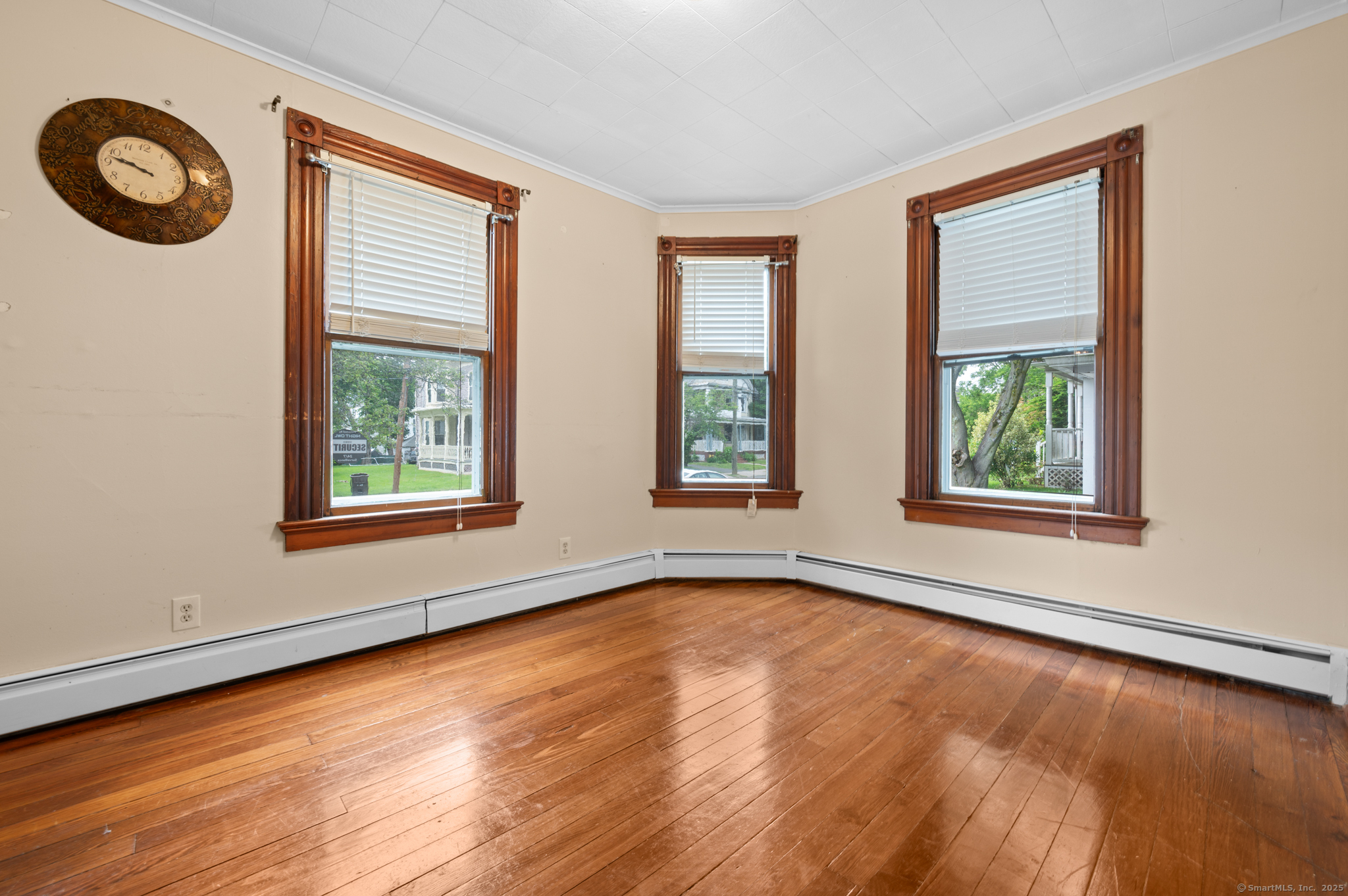 175 Lincoln Street Middletown, CT 06457 - Photo 13 of 33 a view of an empty room with window and wooden floor