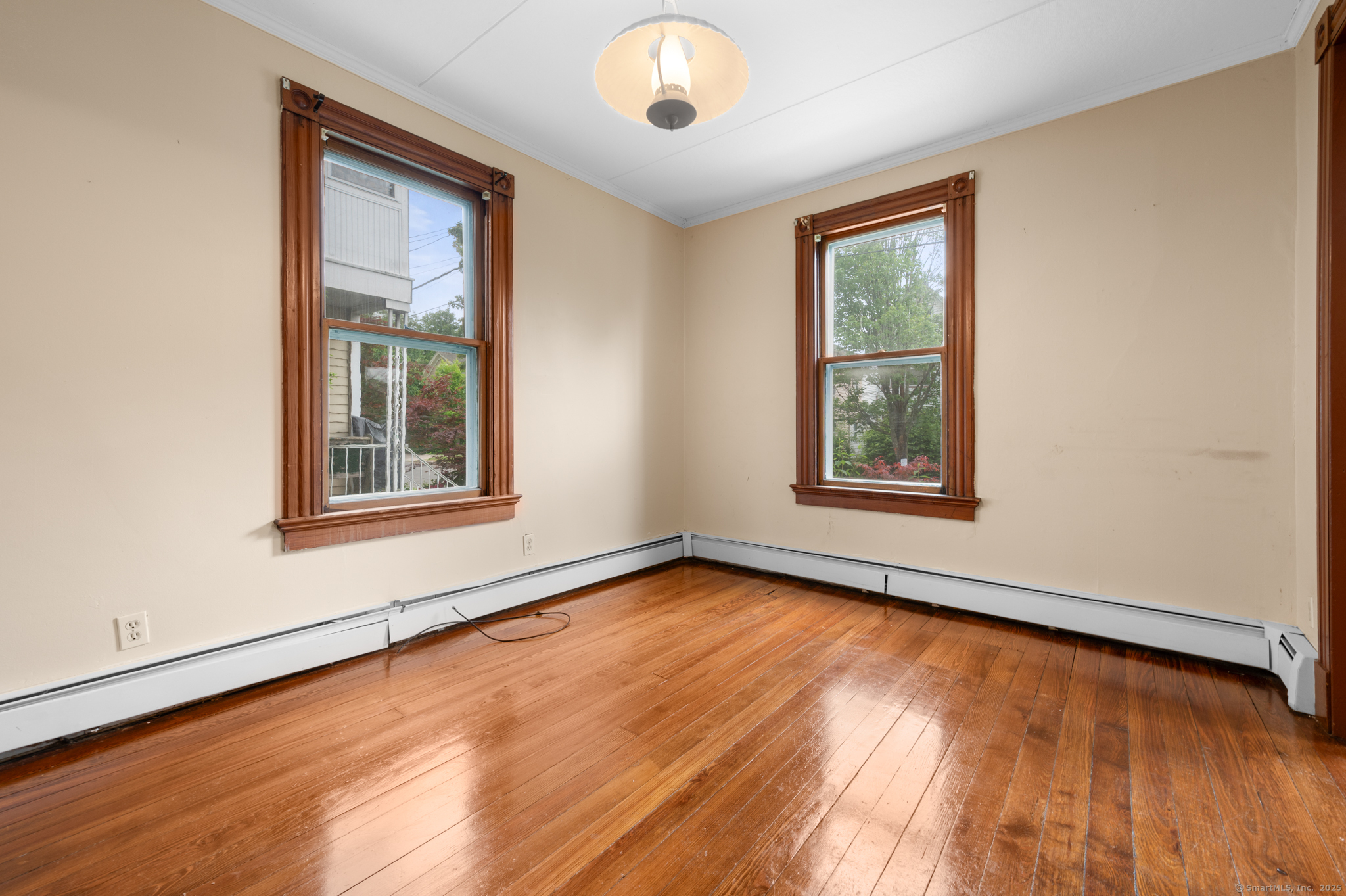 175 Lincoln Street Middletown, CT 06457 - Photo 14 of 33 an empty room with wooden floor and windows