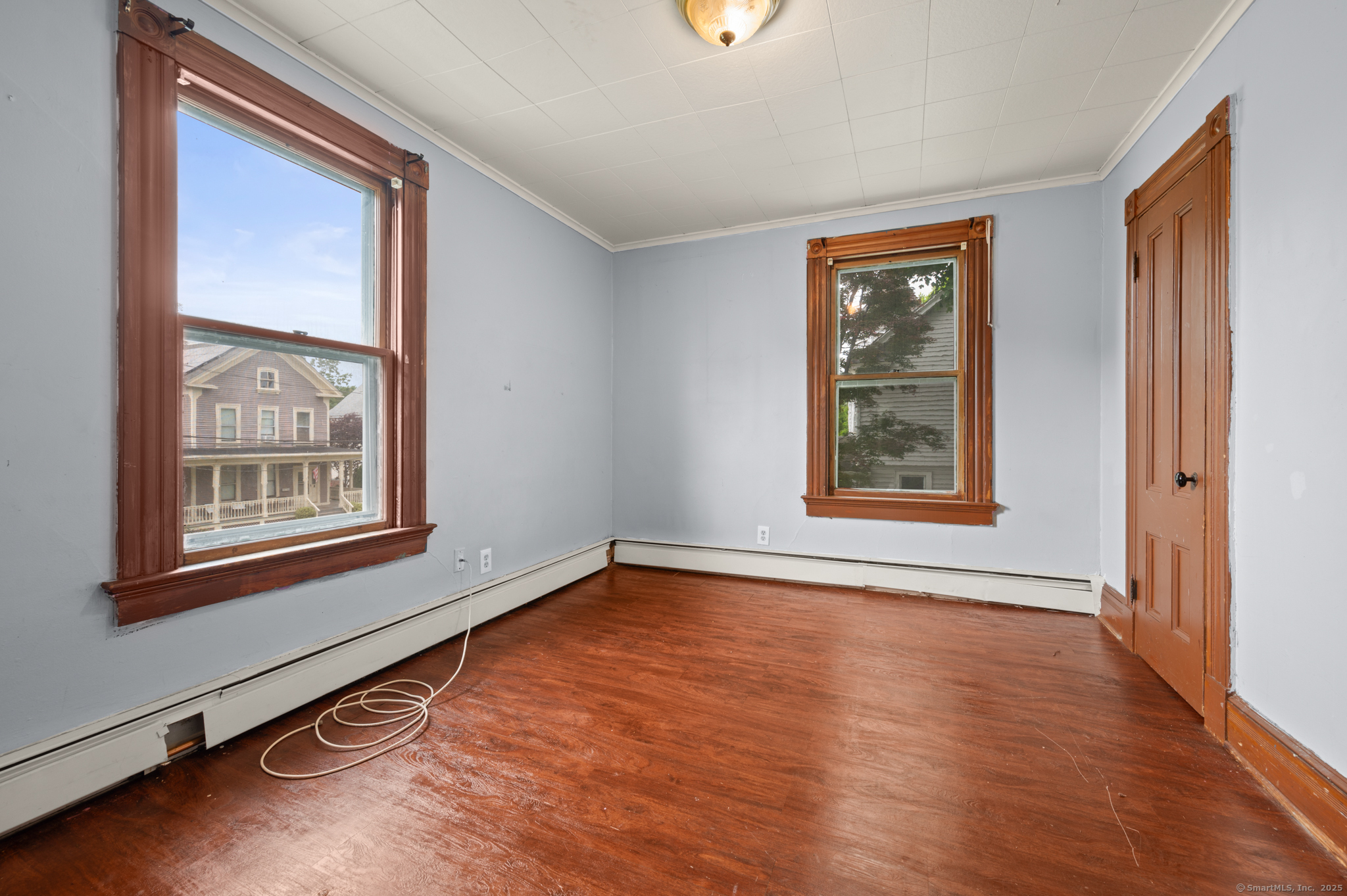 175 Lincoln Street Middletown, CT 06457 - Photo 22 of 33 an empty room with wooden floor and windows