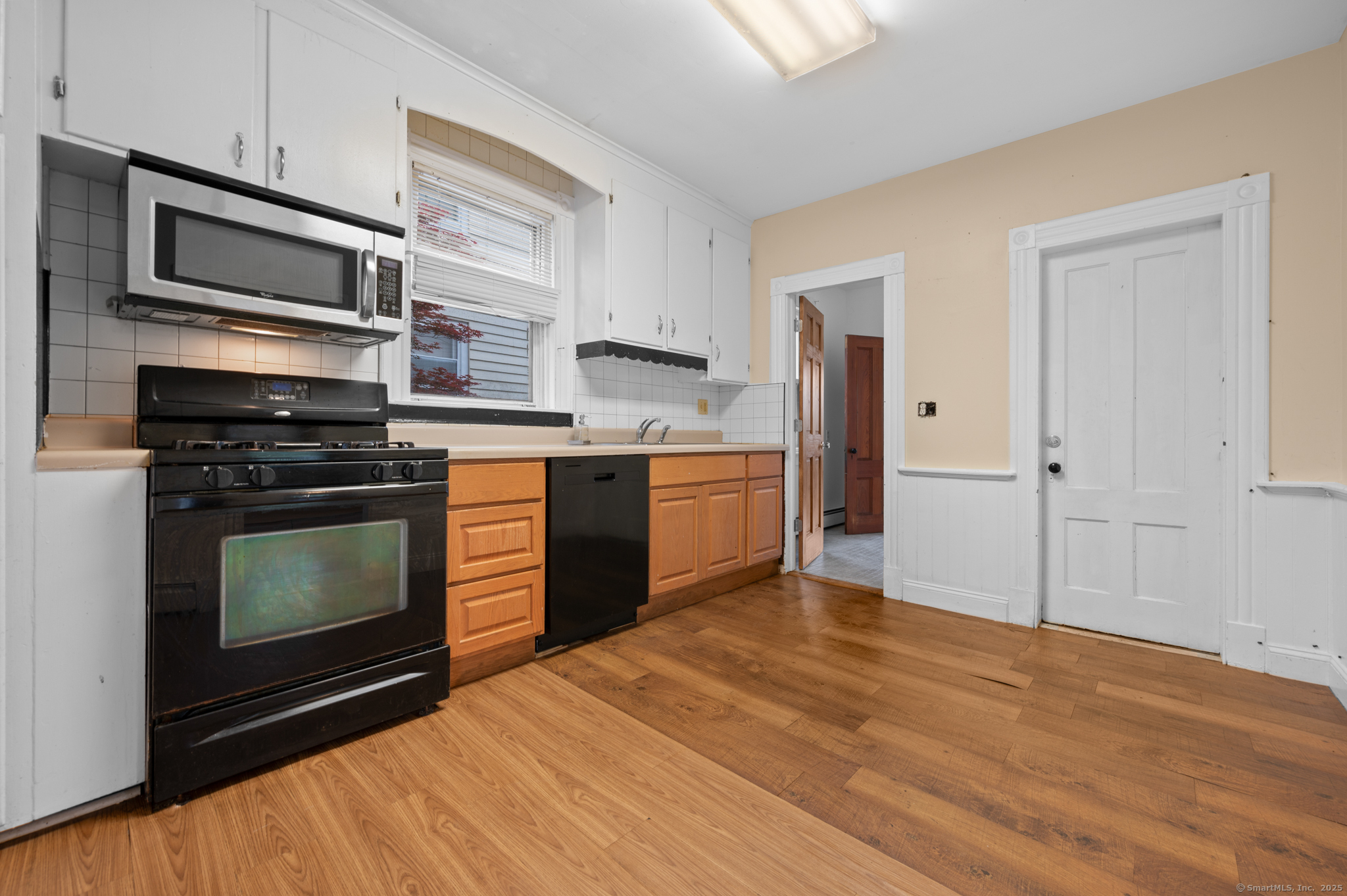 175 Lincoln Street Middletown, CT 06457 - Photo 6 of 33 a kitchen with stainless steel appliances a stove a microwave and cabinets