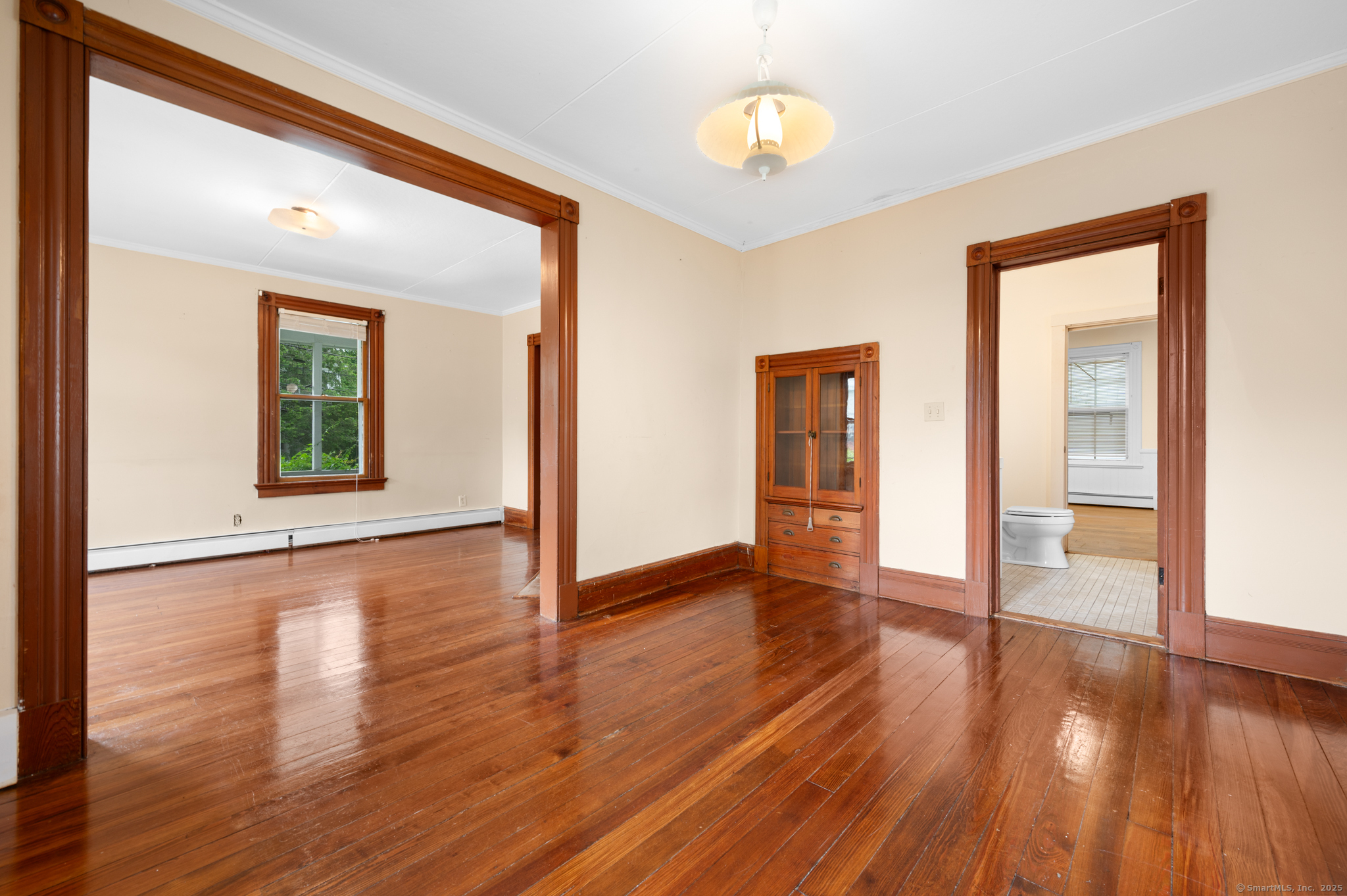 175 Lincoln Street Middletown, CT 06457 - Photo 10 of 33 a view of an empty room with wooden floor and a window