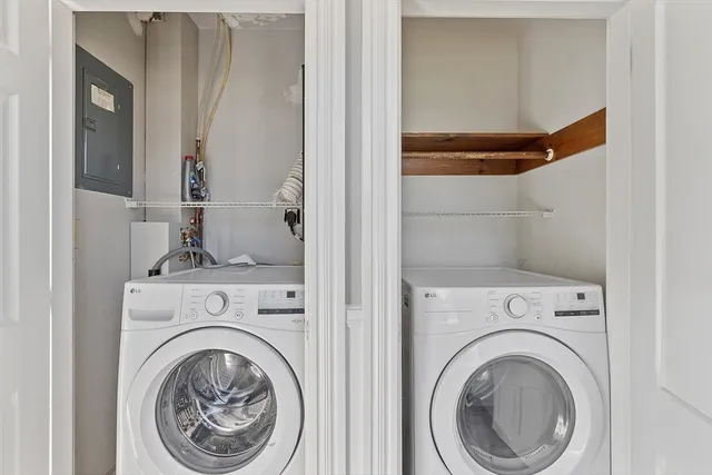 a view of a hallway with washer and dryer