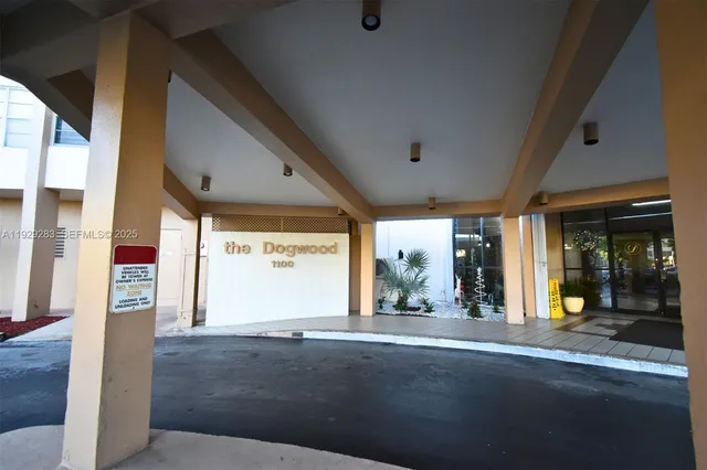 a view of a patio with a table and chairs