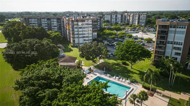 a view of a garden with a house in the background