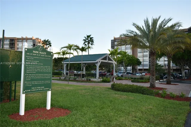 a view of a street with flower plants