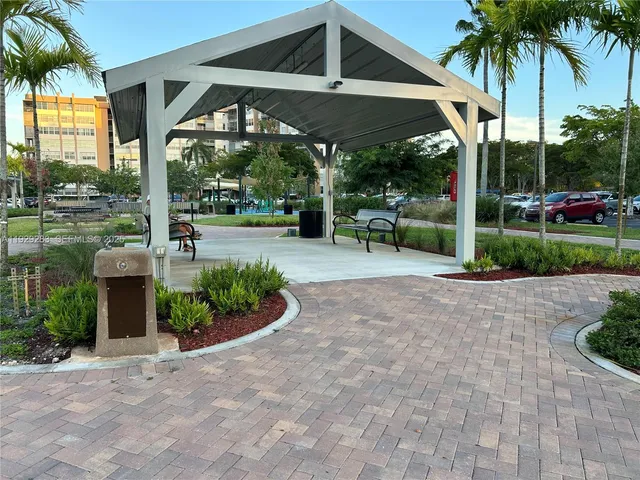 a view of a fountain in front of a house