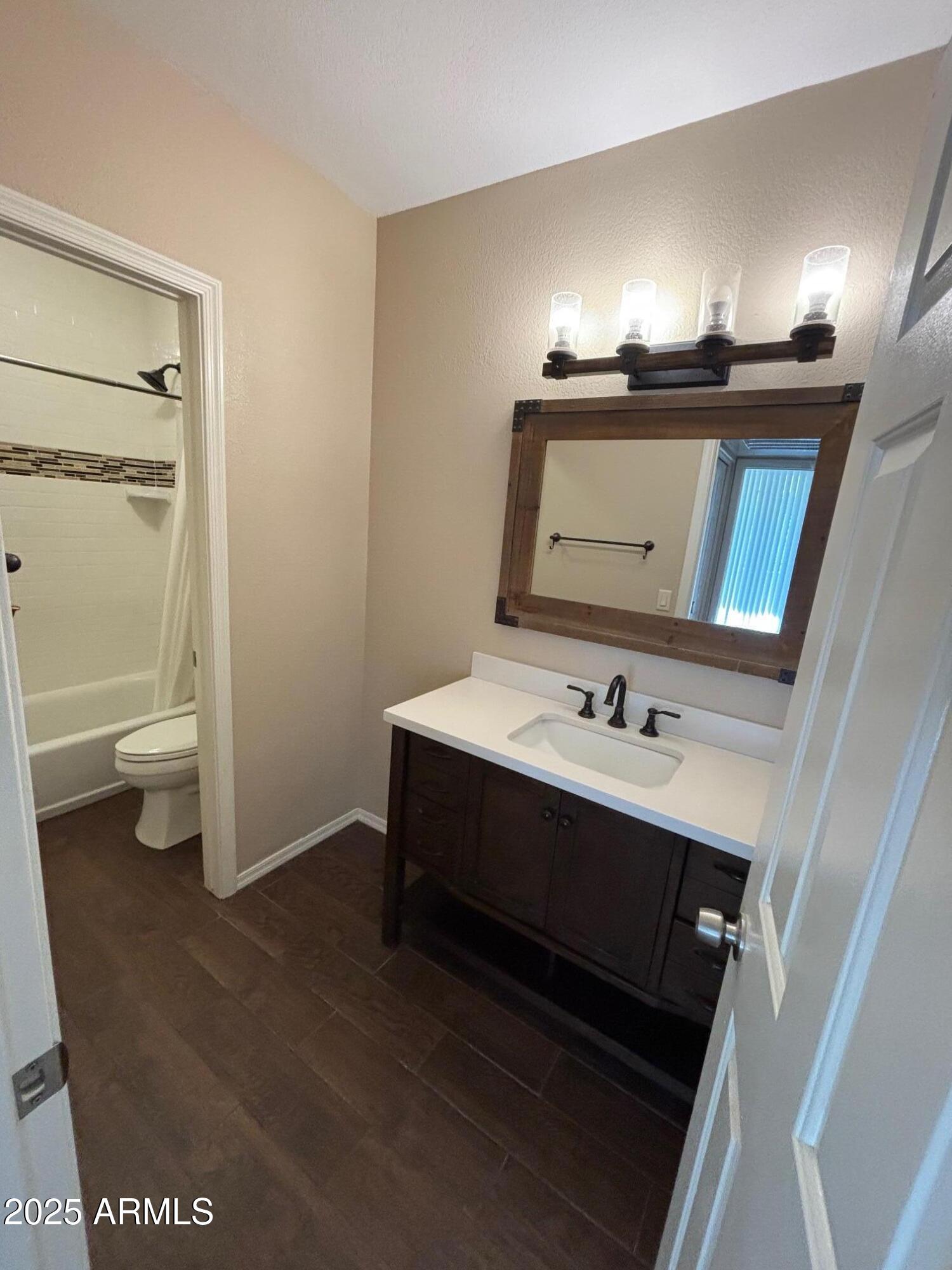 1825 West Ray Road, Unit 2082 Chandler, AZ 85224 - Photo 18 of 37 a bathroom with a sink and a mirror