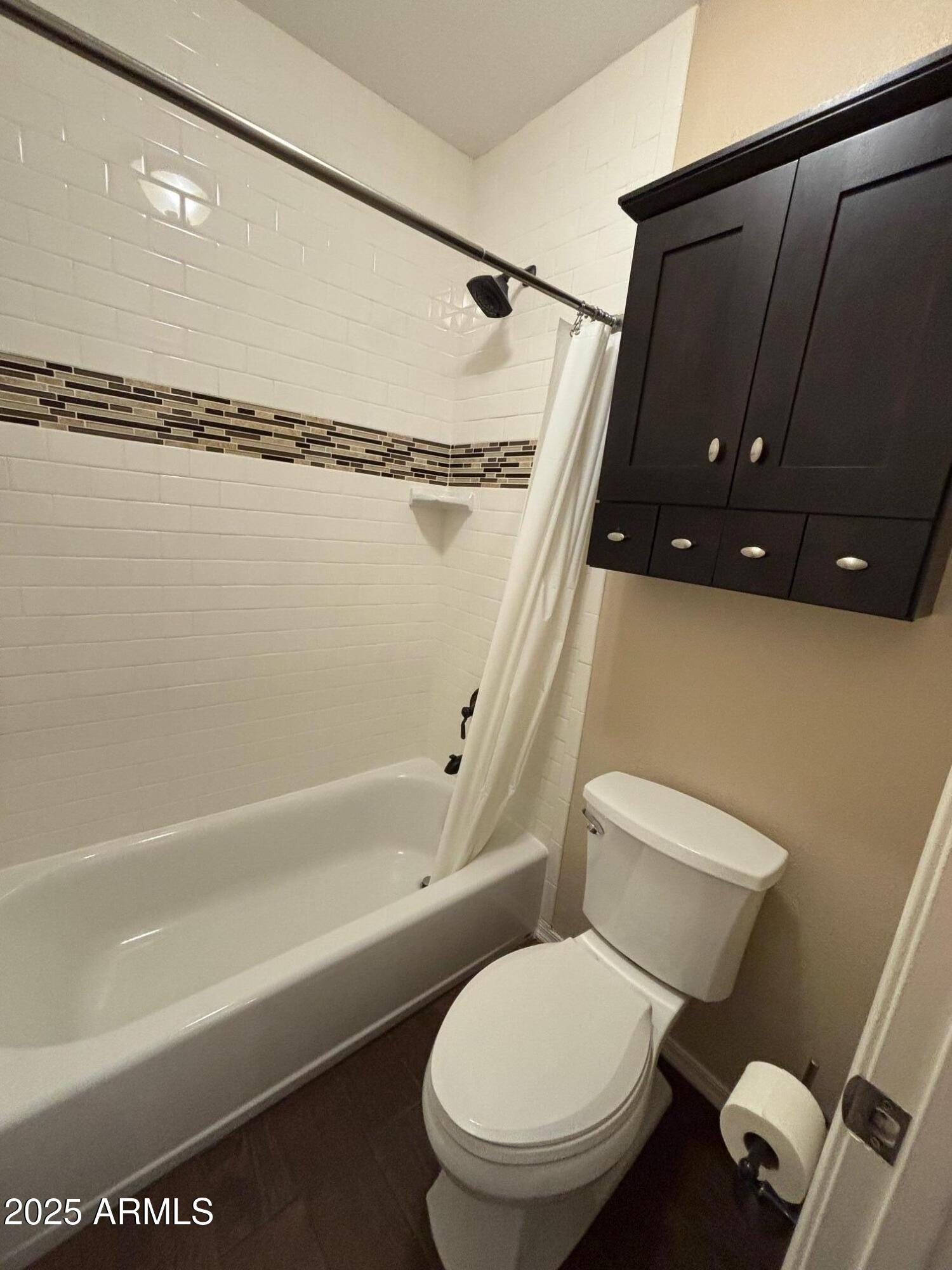 1825 West Ray Road, Unit 2082 Chandler, AZ 85224 - Photo 19 of 37 a bathroom with a toilet and a shower