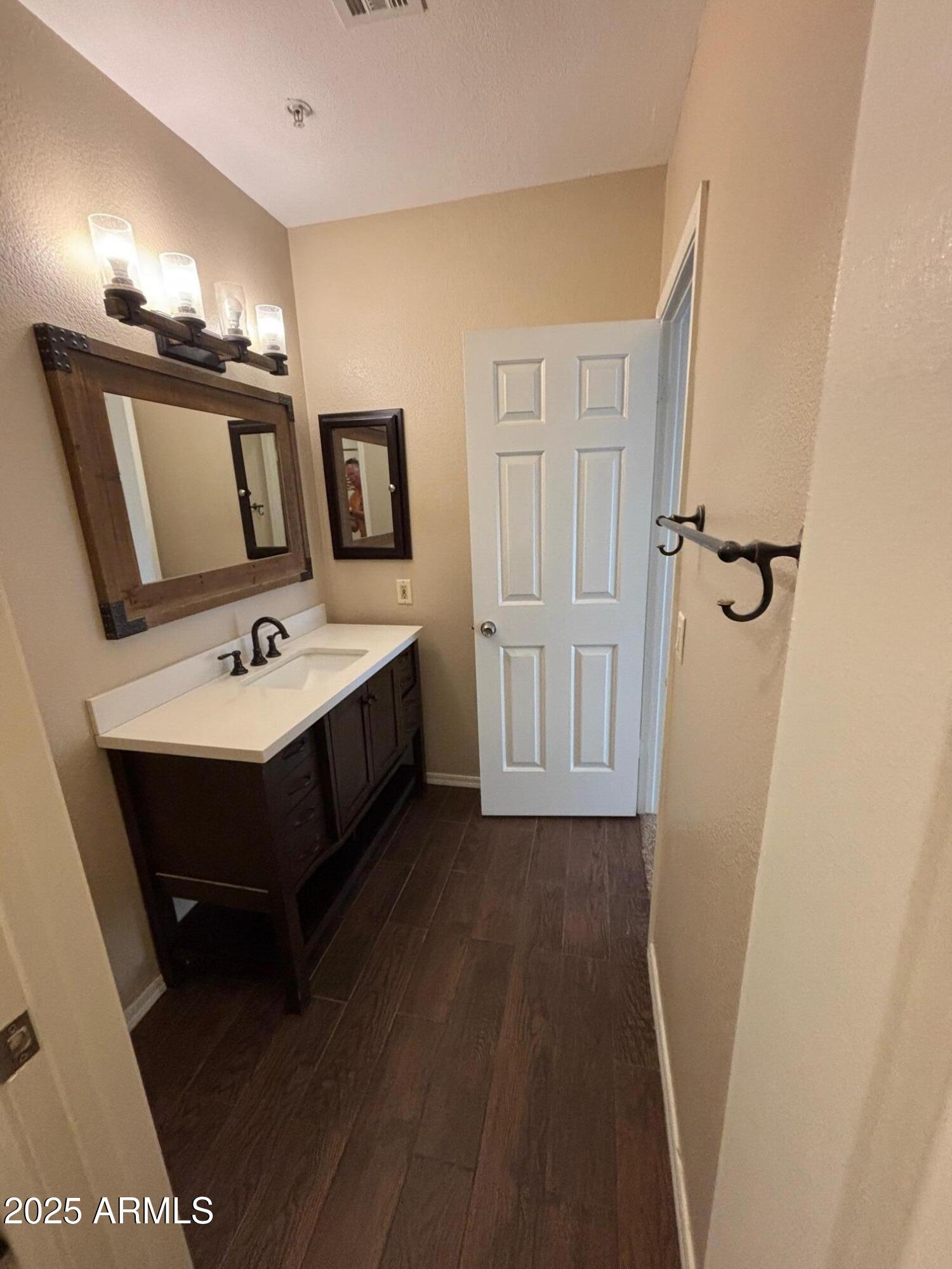 1825 West Ray Road, Unit 2082 Chandler, AZ 85224 - Photo 20 of 37 a spacious bathroom with a bathtub sink and mirror
