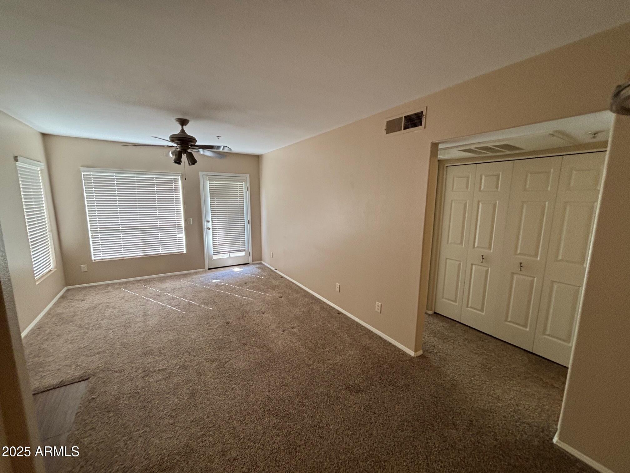 1825 West Ray Road, Unit 2082 Chandler, AZ 85224 - Photo 7 of 37 a view of an empty room with a window