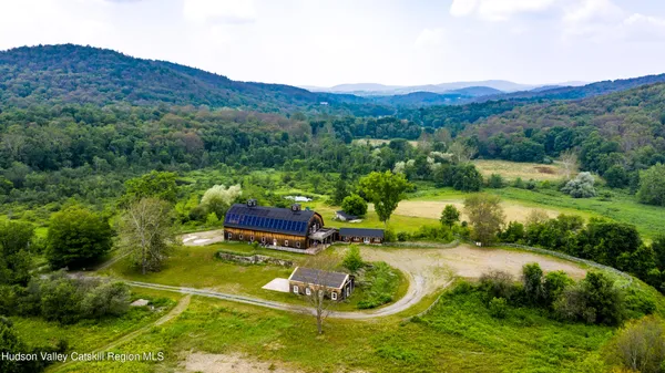 an aerial view of a house with outdoor space swimming pool