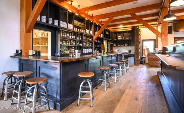 a view of a cafe with table and chairs
