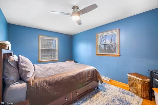4618 South Arlington Road Uniontown, OH 44685 - Photo 23 of 31 Bedroom with light wood-type flooring and ceiling fan