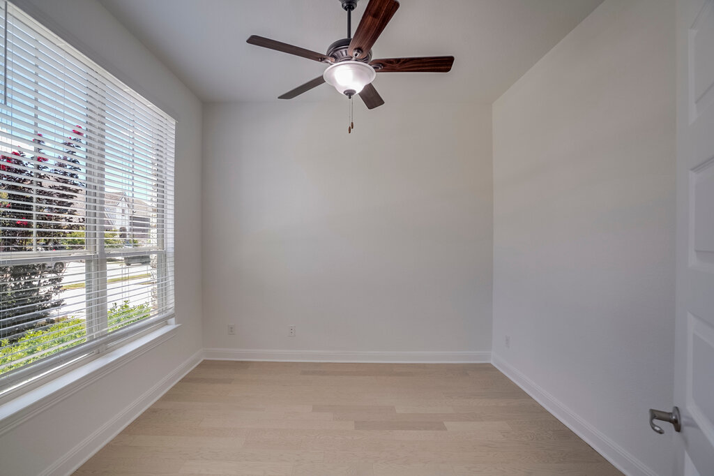 2920 Hadley Way Leander, TX 78641 - Photo 8 of 20 Hardwood floors and a bright window with blinds enhance this versatile room.