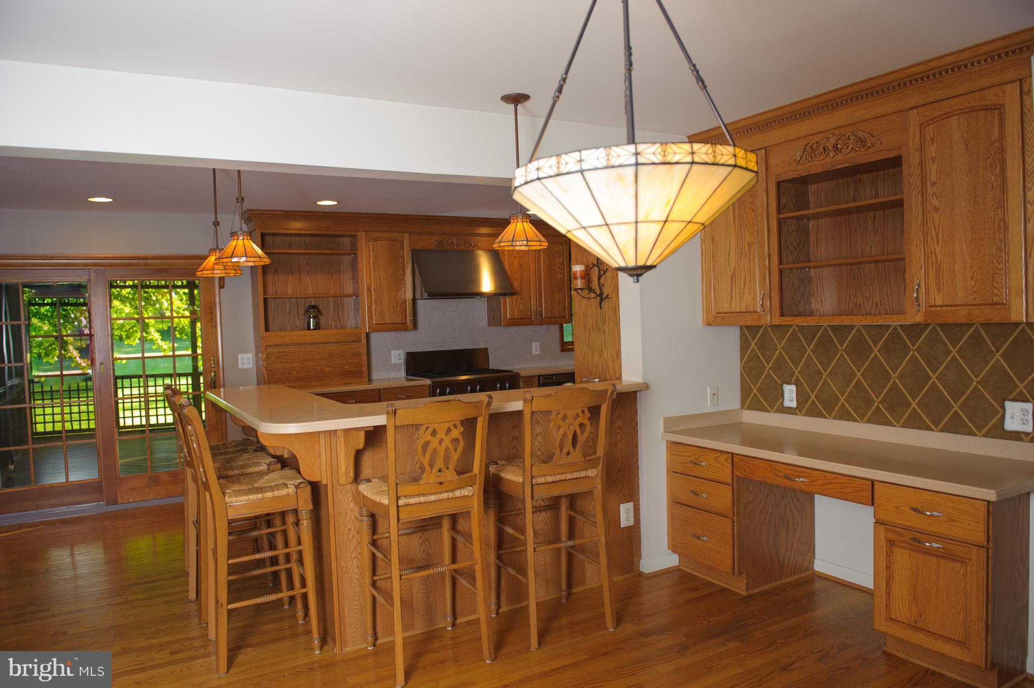 957 St George Barber Road Davidsonville, MD 21035 - Photo 10 of 30 Table Space Area w/View of Family Room and Porch