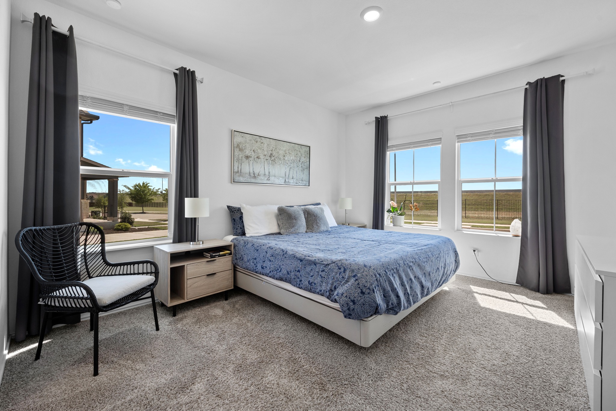 1500 Linwood Street Leander, TX 78641 - Photo 15 of 38 a spacious bedroom with a bed and a large window