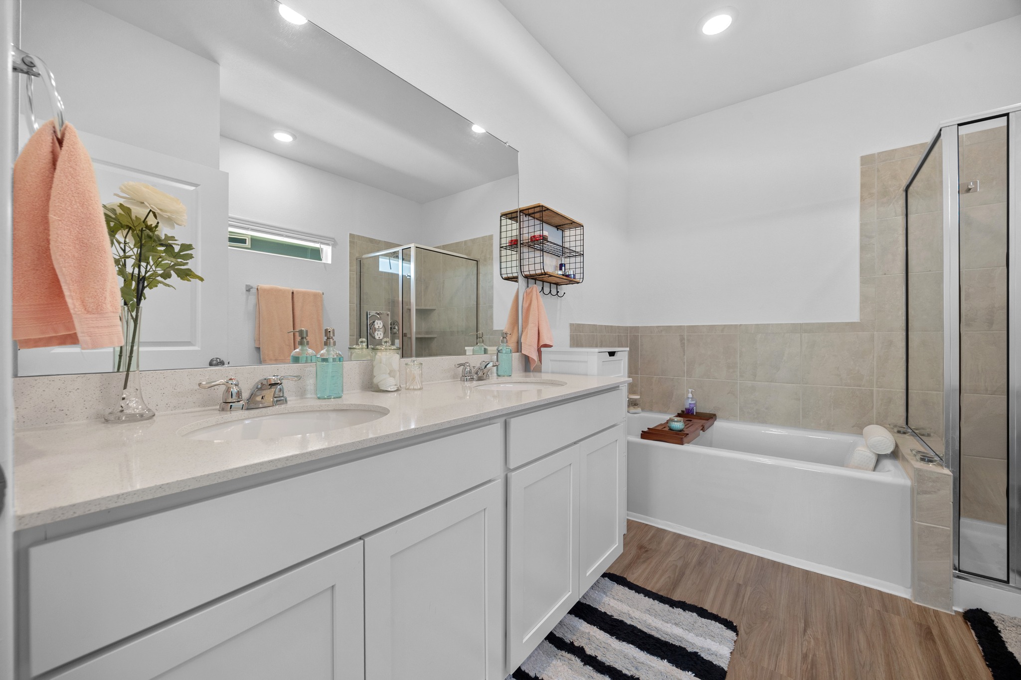 1500 Linwood Street Leander, TX 78641 - Photo 17 of 38 a bathroom with a tub sink and mirror