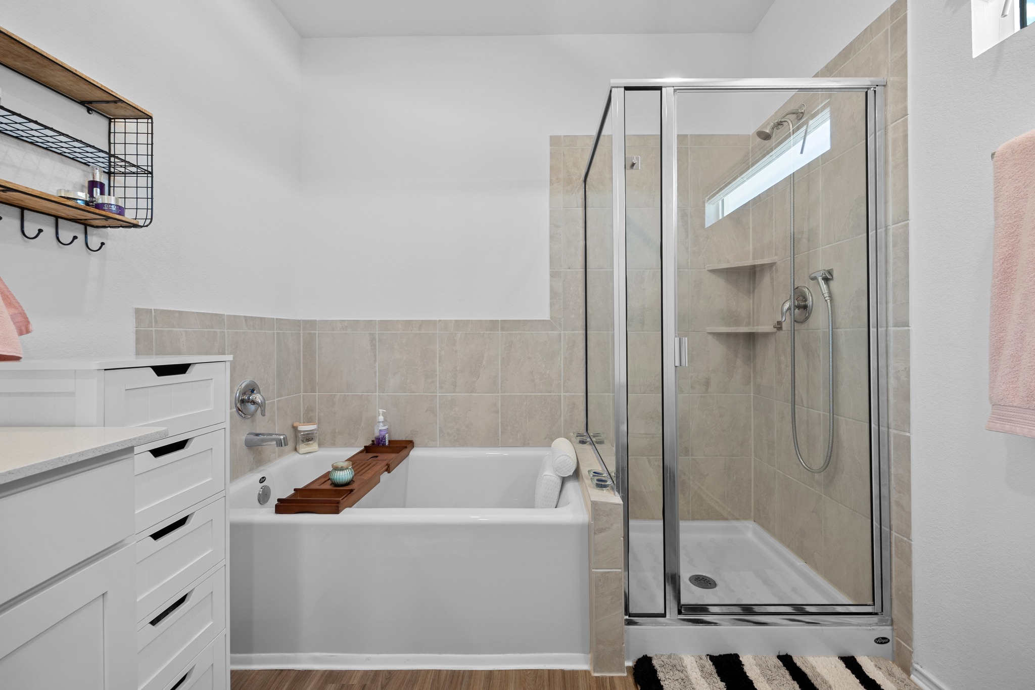 1500 Linwood Street Leander, TX 78641 - Photo 18 of 38 a bathroom with a tub sink a mirror and shower