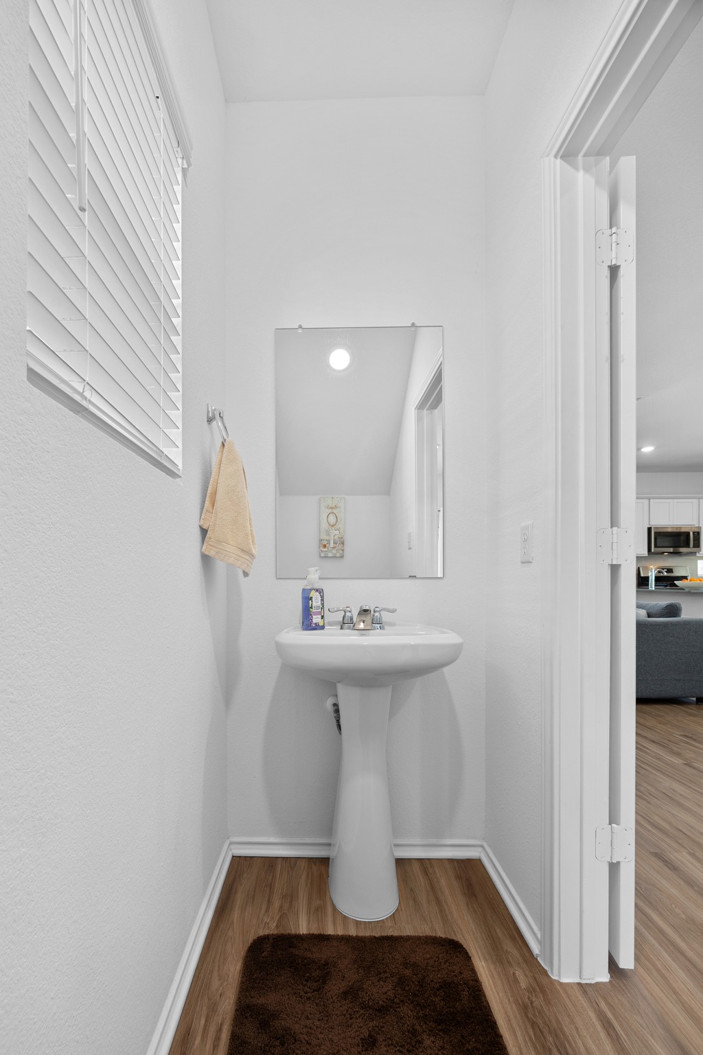 1500 Linwood Street Leander, TX 78641 - Photo 19 of 38 a bathroom with a sink a mirror and toilet