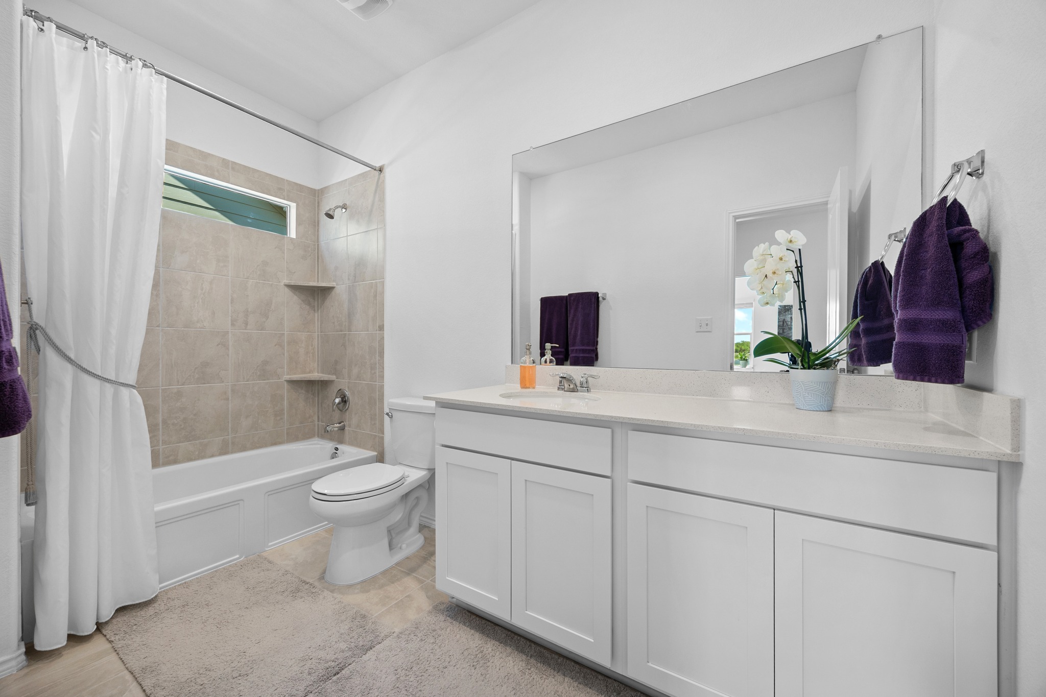 1500 Linwood Street Leander, TX 78641 - Photo 21 of 38 a bathroom with a double vanity sink toilet and shower