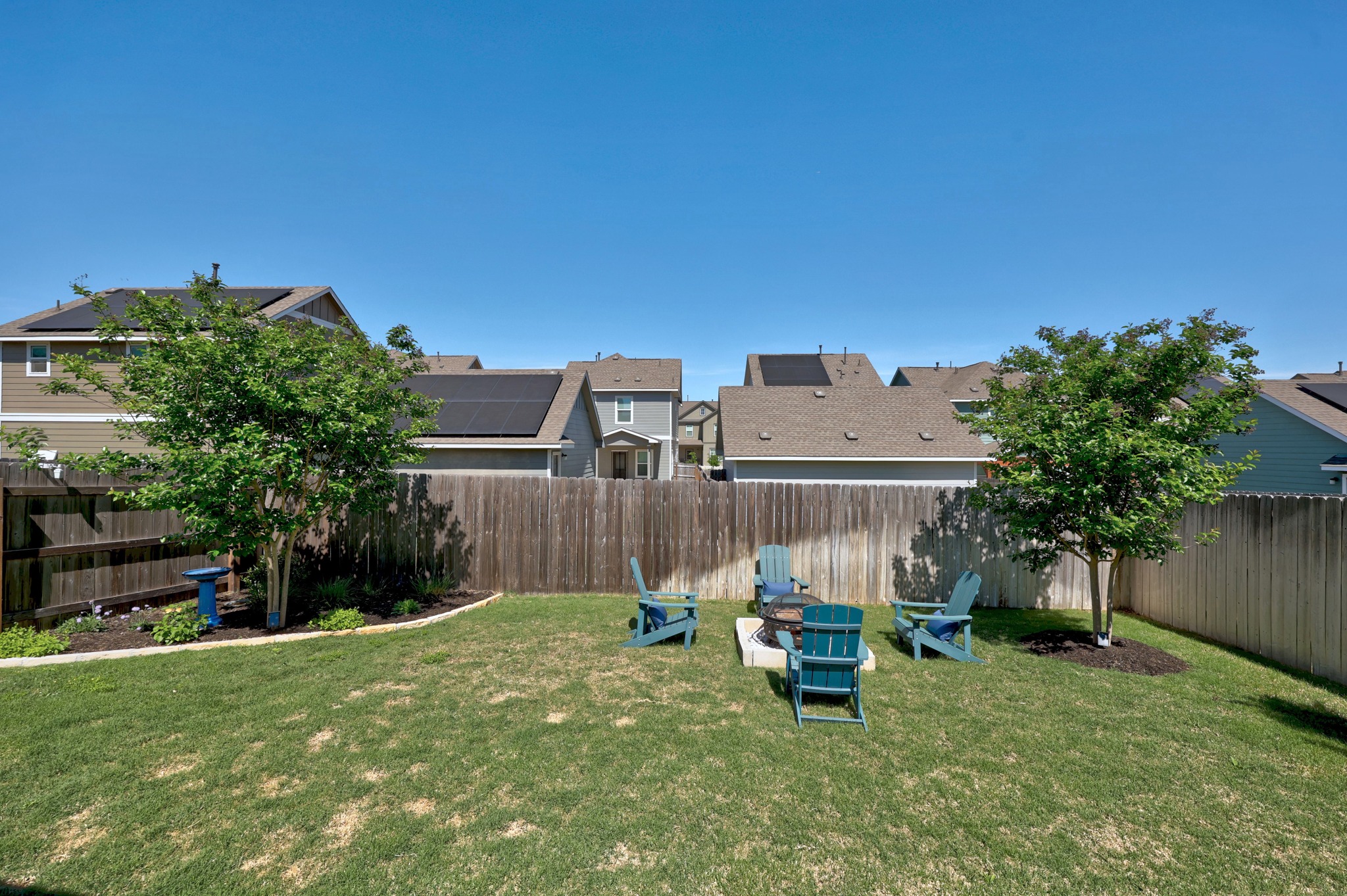 1500 Linwood Street Leander, TX 78641 - Photo 31 of 38 a view of a backyard with plants and a bench