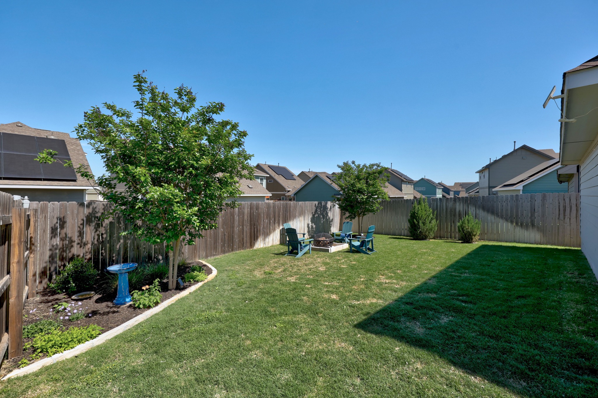 1500 Linwood Street Leander, TX 78641 - Photo 34 of 38 a view of a backyard with couches plants and large tree
