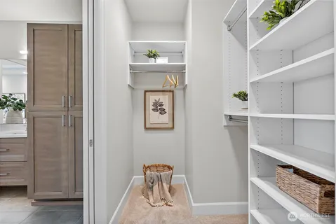 a balcony view with couple of chairs