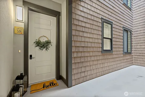 a view of a hallway with paintings on the wall