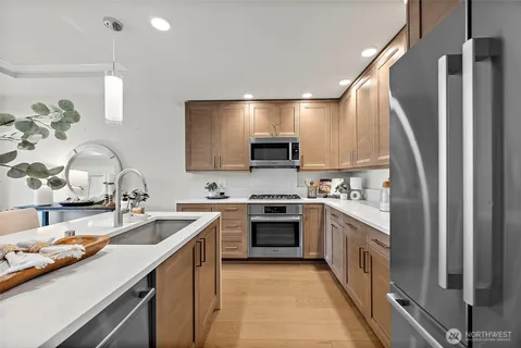 a kitchen with a sink stove and cabinets